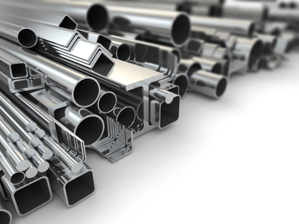 assortment of structural steel beams, pipe and bars