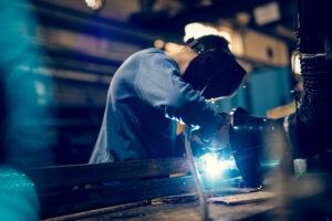 Man using mig mag welder