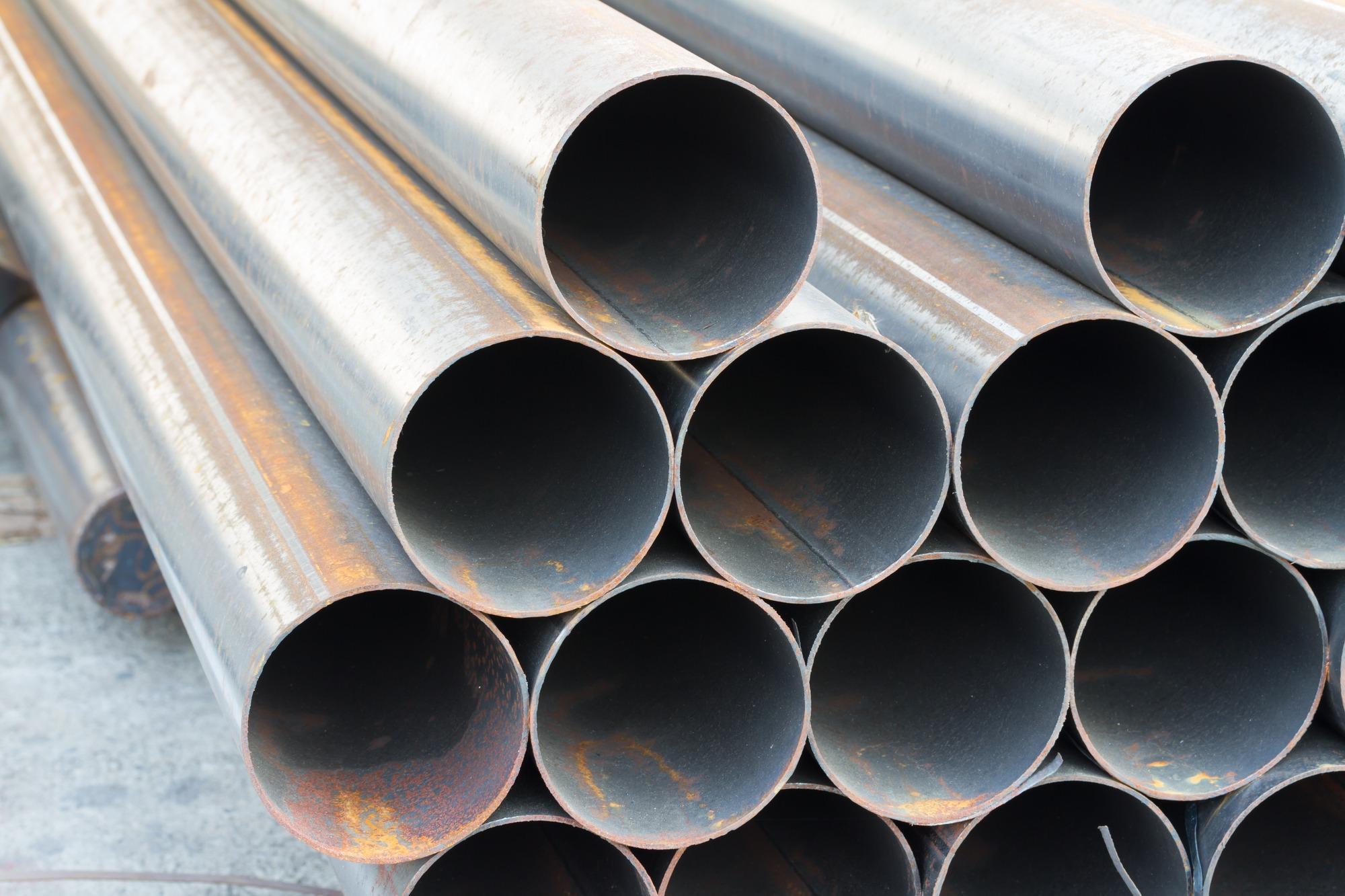 carbon steel pipes stacked on top of each other