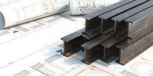 steel beams resting on top of construction papers