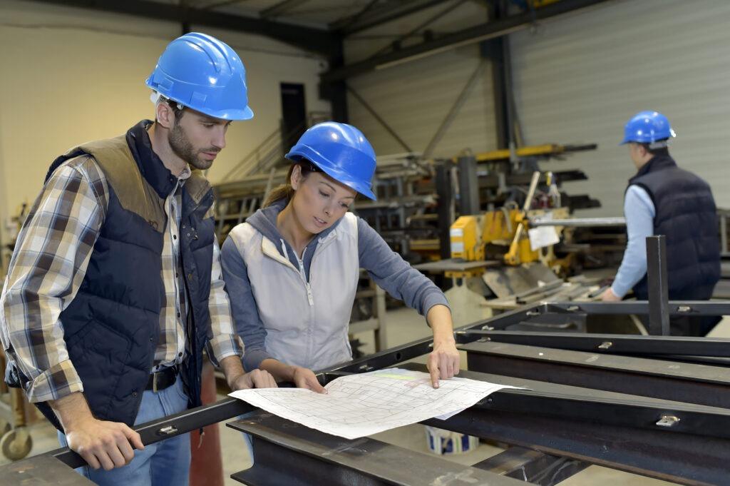 industrial engineers next to steel beams