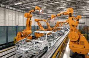 Robot technology crafting cars from steel in a factory