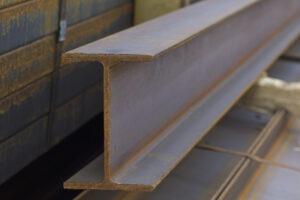 Metal profile beam in packs at the warehouse of metal products.