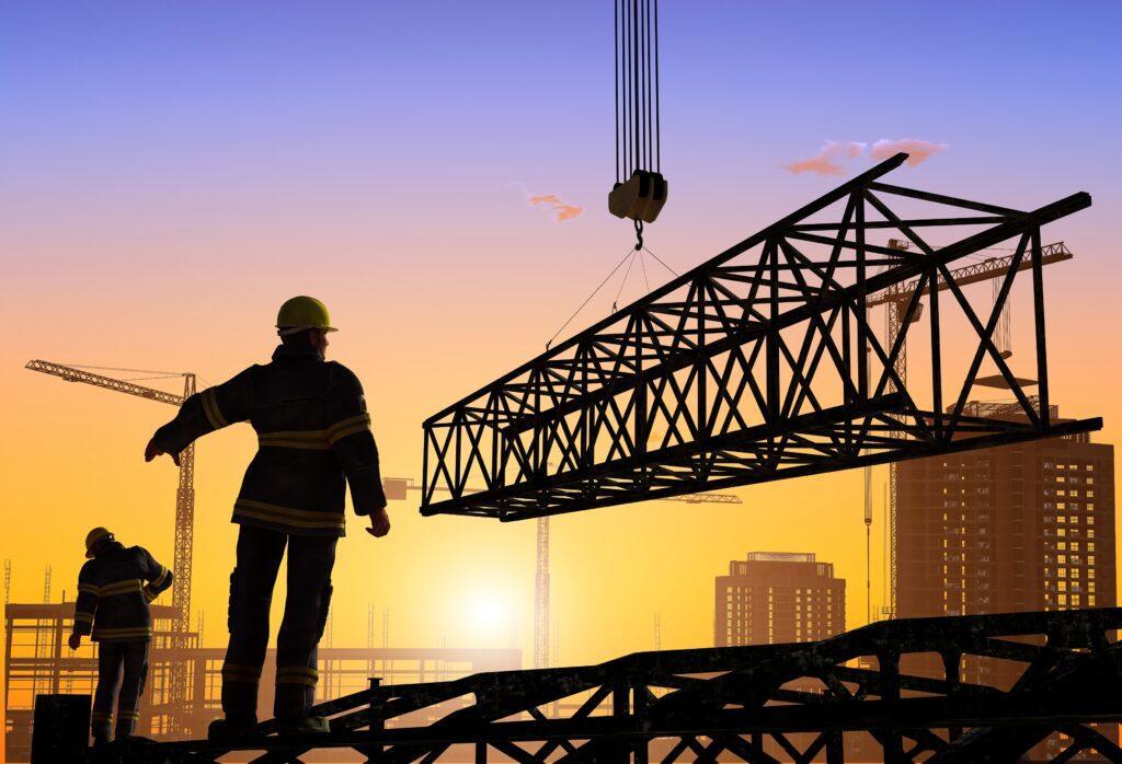 Silhouettes of construction workers on a construction site.