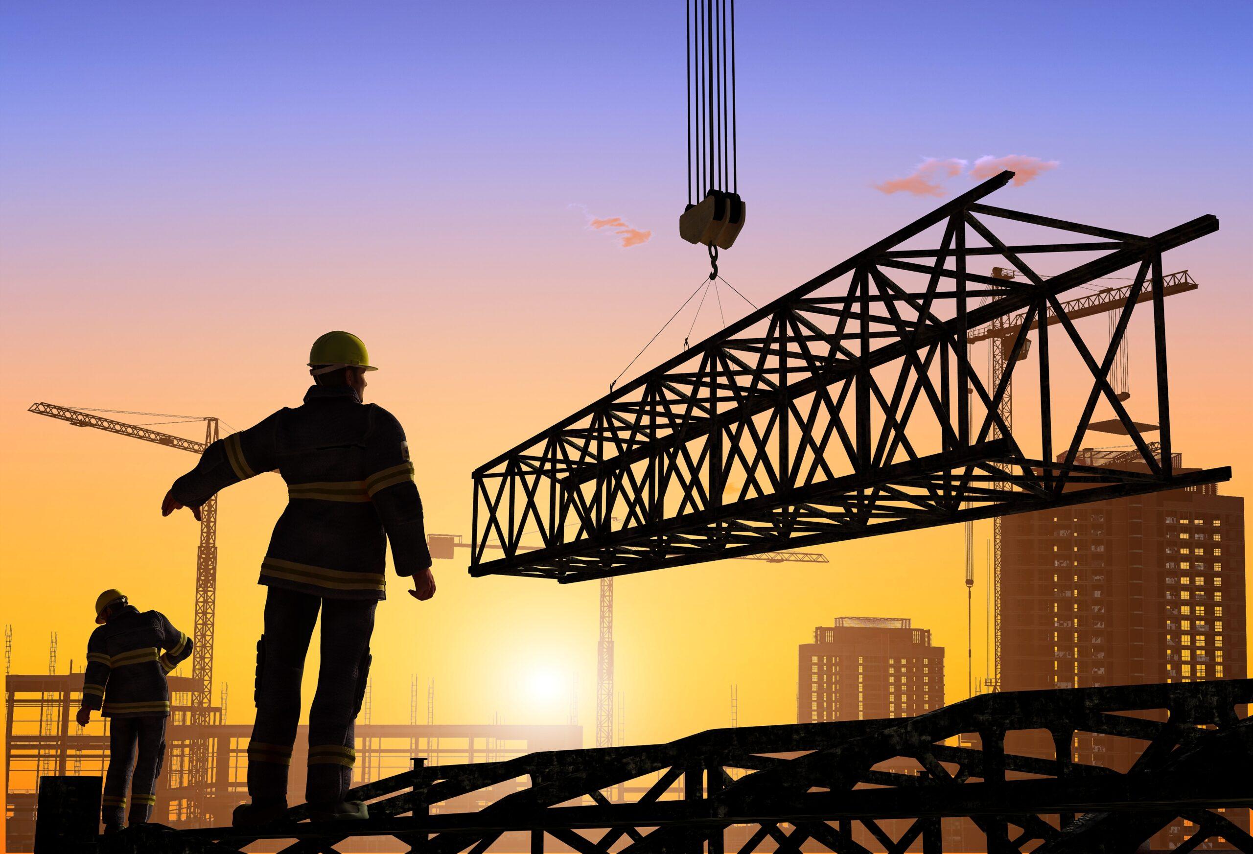 Silhouettes of construction workers on a construction site.