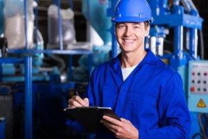 male industrial technician working inside a factory