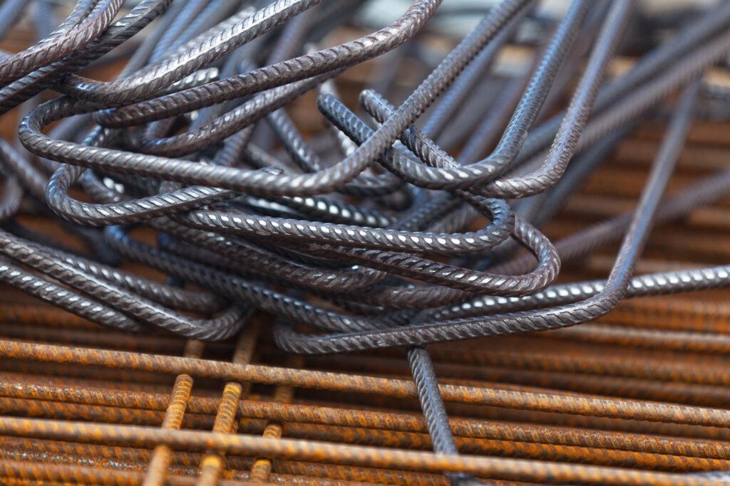 A pile of steel rebars on a construction site.
