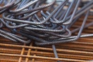 A pile of steel rebars on a construction site.